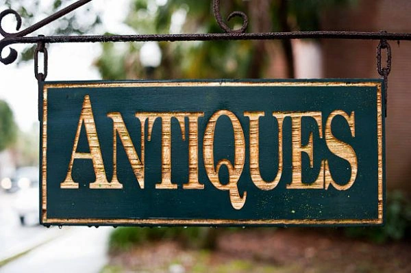 Old fashion hanging Antiques sign
